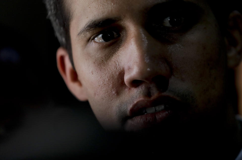 Juan Guaido, Venezuelan opposition leader and self-proclaimed interim president, looks on after a meeting at a university in Caracas, Venezuela, Monday, April 1, 2019. He’s backed by more than 50 nations, which consider Nicolas Maduro’s presidency illegitimate following what they call sham elections last year. “We must unite now more than ever,” said Guaido, speaking at the university. "We must mount the biggest demonstration so far to reject what’s happening." (AP Photo/Natacha Pisarenko)