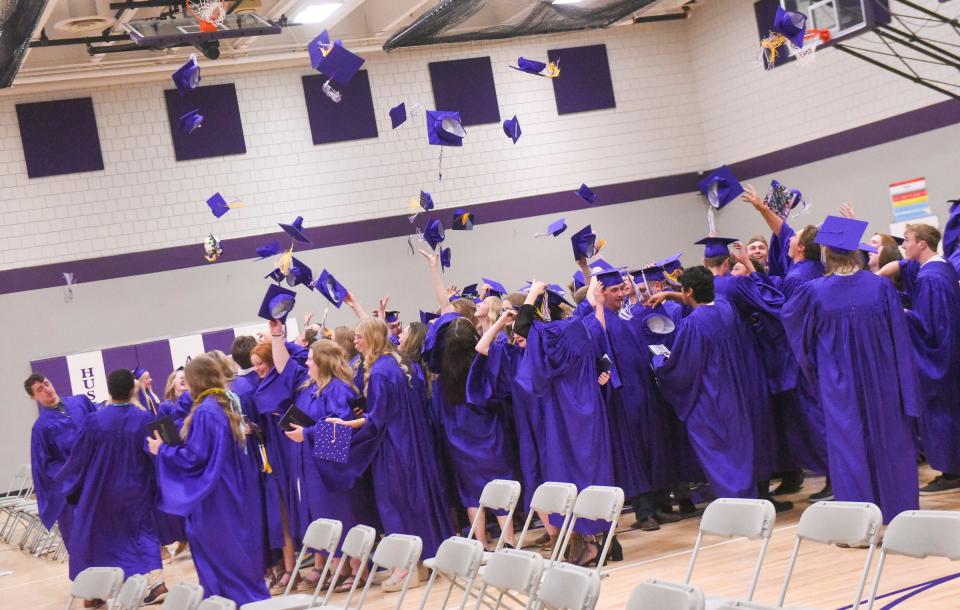 The Albany Class of 2022 throws their caps in the air Friday, May 27, 2022, in the Albany High School gymnasium.