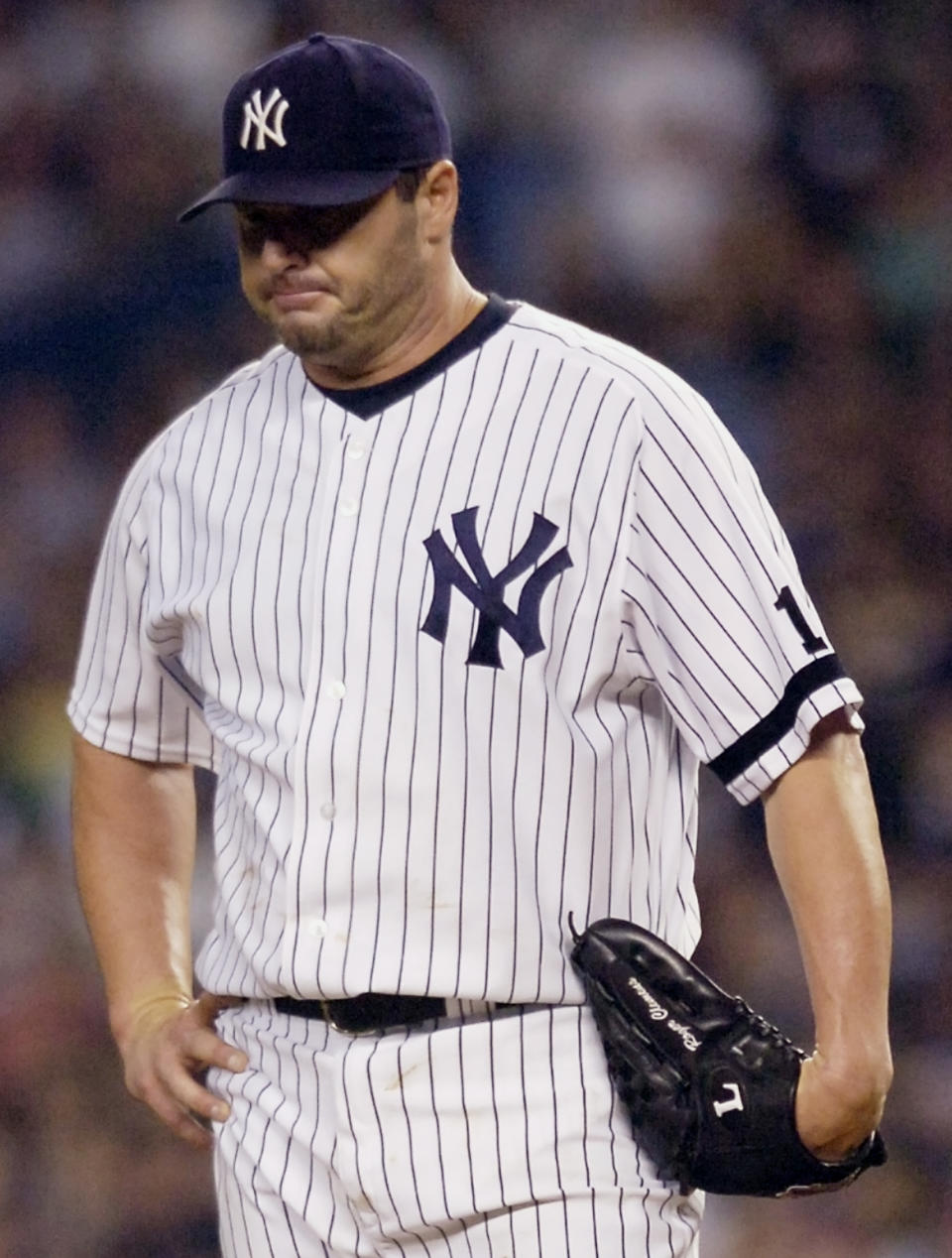 FILE - New York Yankees pitcher Roger Clemens reacts after giving up a home run to Cleveland Indians' Trot Nixon in the second inning during Game 3 of an American League baseball division playoff series on Oct. 7, 2007, at Yankee Stadium in New York. David Ortiz was elected to the Baseball Hall of Fame in his first turn on the ballot, while steroid-tainted stars Barry Bonds and Roger Clemens were denied entry to Cooperstown in their final year under consideration by the Baseball Writers’ Association of America, on Tuesday, Jan. 25, 2022. (AP Photo/Bill Kostroun, File)