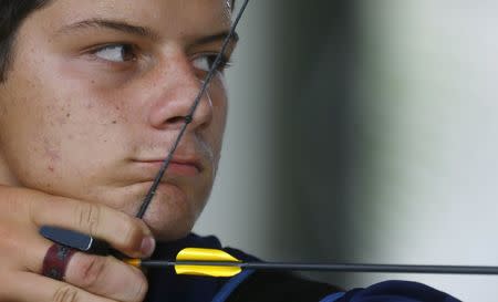 Marcus Vinicius D'Almeida, 17, shoots during an archery match at the Brazilian Archery Confederation in Marica, near Rio de Janeiro, March 21, 2015. REUTERS/Ricardo Moraes