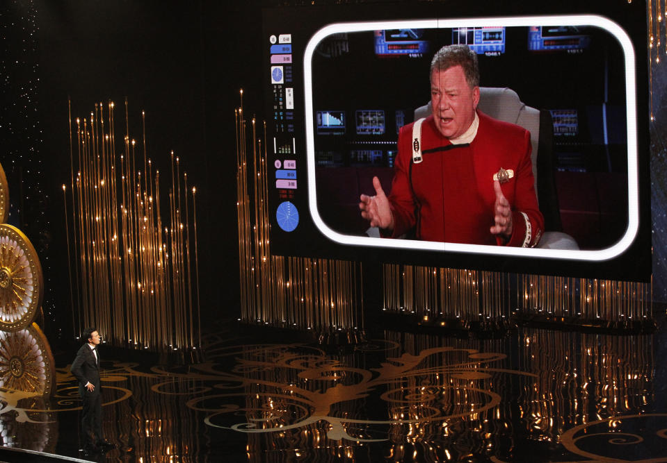 Oscar host Seth MacFarlane watches William Shatner on a screen during the opening segment of the 85th Academy Awards in Hollywood, California February 24, 2013.    REUTERS/Mario Anzuoni (UNITED STATES  - Tags: ENTERTAINMENT TPX IMAGES OF THE DAY)  (OSCARS-SHOW)