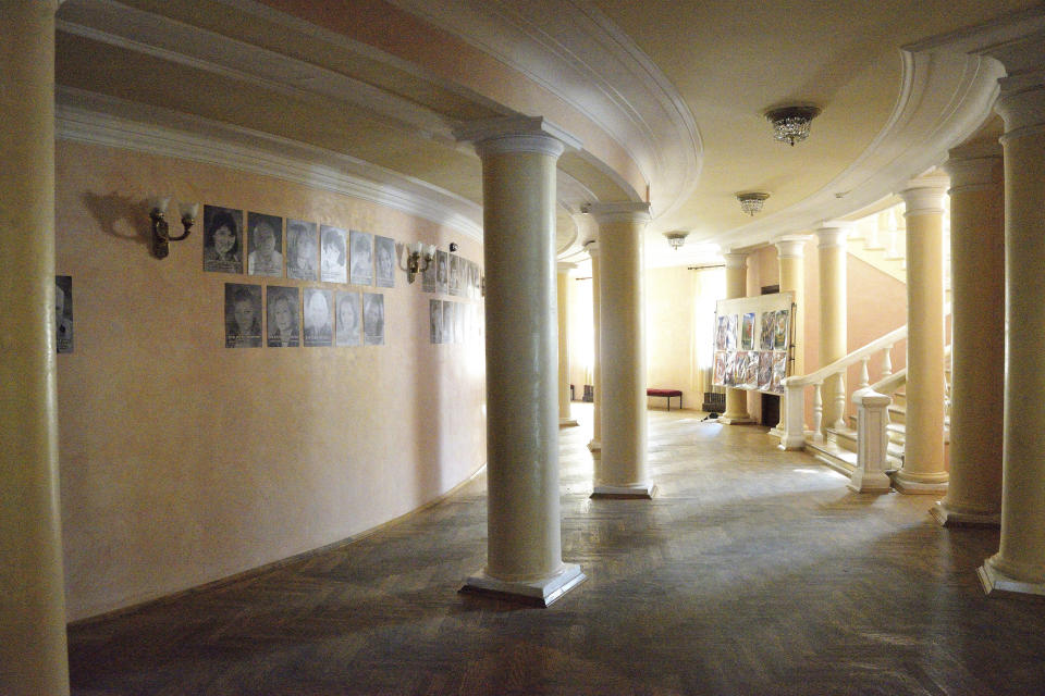 Pictures hang on the wall of the Donetsk Academic Regional Drama Theatre in Mariupol, Ukraine, Sept. 10, 2018. The March 16, 2022, bombing of the theater that was used as a shelter stands out as the single deadliest known attack against civilians to date in the war in Ukraine. (Lev Sandalov via AP)