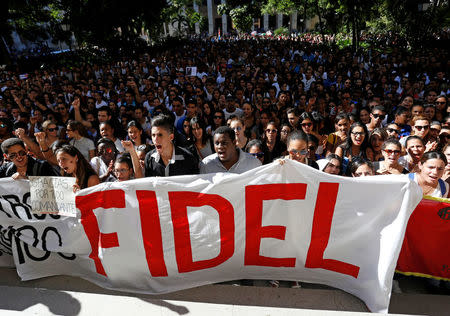 Students of Havana University pay tribute to Cuba's late President Fidel Castro as they march to Revolution Square in Havana, Cuba, November 28, 2016. REUTERS/Stringer