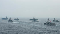 In this photo released by U.S. Navy, US Navy aircraft carrier USS Carl Vinson (CVN 70) and other US and Allies vessels transit the Bay of Bengal as part of MALABAR 2021, on Oct. 12, 2021. China seeks to bring the strategically and symbolically important island back under its control, and the U.S. sees Taiwan in the context of broader challenges from China. (Russel Lindsey/US Navy via AP)