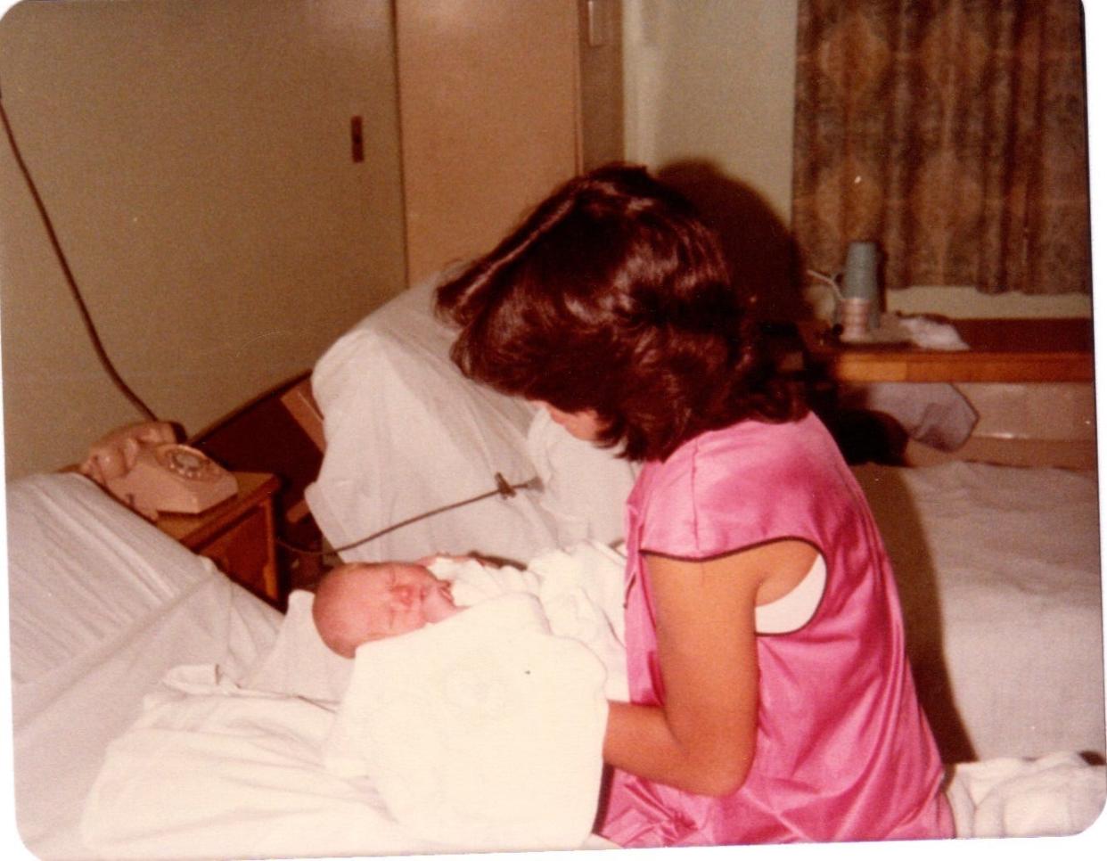 Terri Paige and her eldest son Jason in the hospital following his birth in 1980. Terri had her first child in the summer between her junior and senior year of high school. She now has eight grown children.
