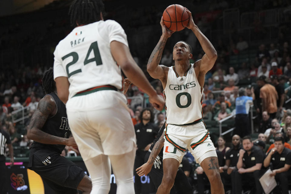 Miami guard Matthew Cleveland (0) goes up for a shot against the Florida International during the first half of an NCAA college basketball game, Monday, Nov. 13, 2023, in Coral Gables, Fla. (AP Photo/Jim Rassol)