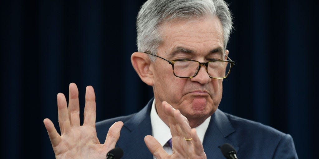 U.S. Federal Reserve Chairman Jerome Powell reacts during a press conference