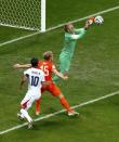 Goalkeeper Jasper Cillessen of the Netherlands (R) saves the ball as his teammate Dirk Kuyt defends near Costa Rica's Bryan Ruiz (10) during their 2014 World Cup quarter-finals at the Fonte Nova arena in Salvador July 5, 2014. REUTERS/Ruben Sprich