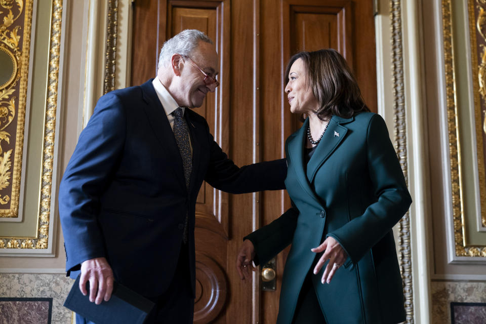 Senate Majority Leader Sen. Chuck Schumer, D-N.Y., talks with Vice President Kamala Harris after presenting Harris with a golden gavel after she cast the 32nd tie-breaking vote in the Senate, the most ever cast by a vice president, Tuesday, Dec. 5, 2023, on Capitol Hill in Washington. (AP Photo/Stephanie Scarbrough)