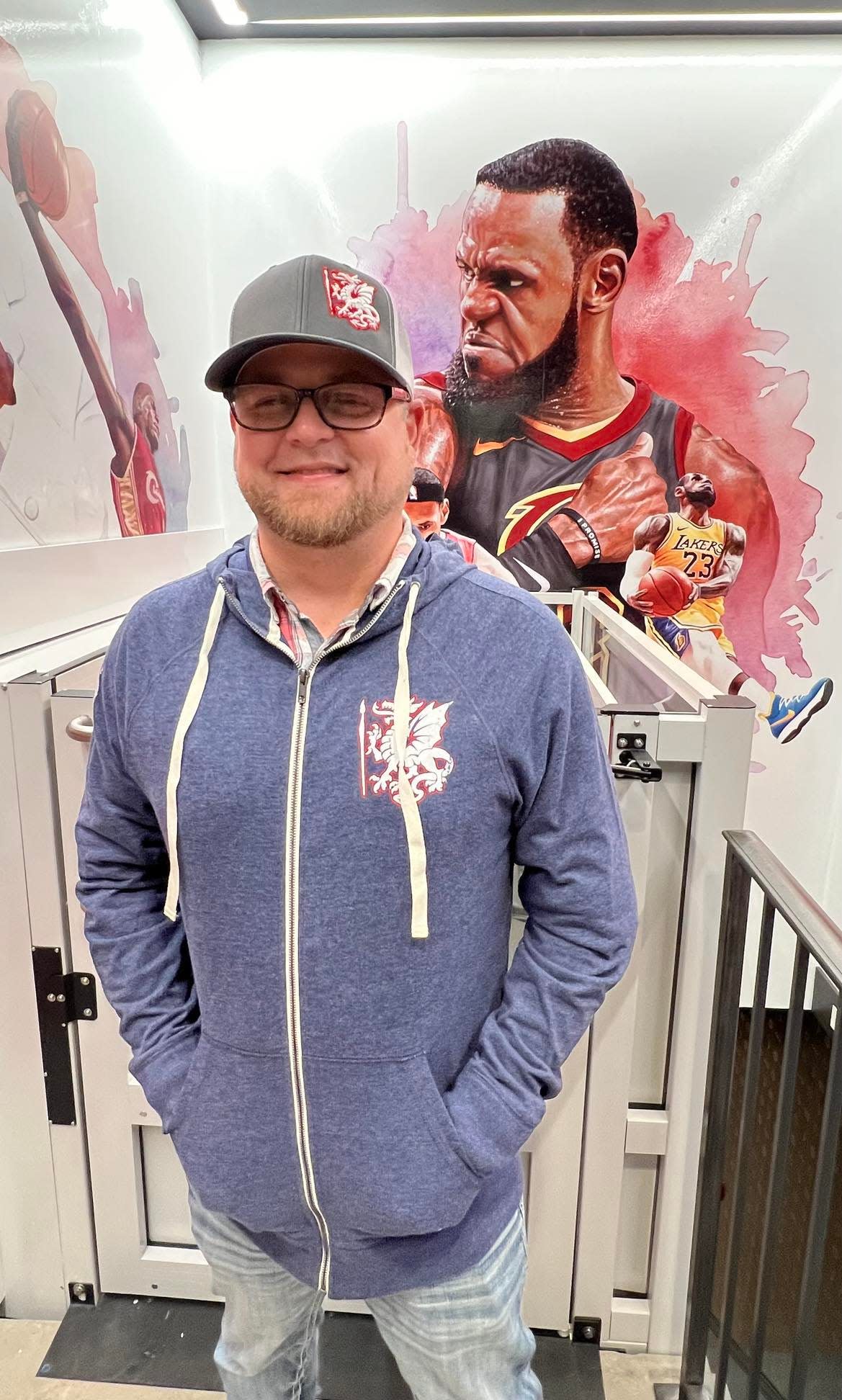 Stark County resident Dirk Rozich is shown at House Three Thirty in Akron where the artwork he created of LeBron James is displayed at the entrance to the new LeBron James' Home Court museum.