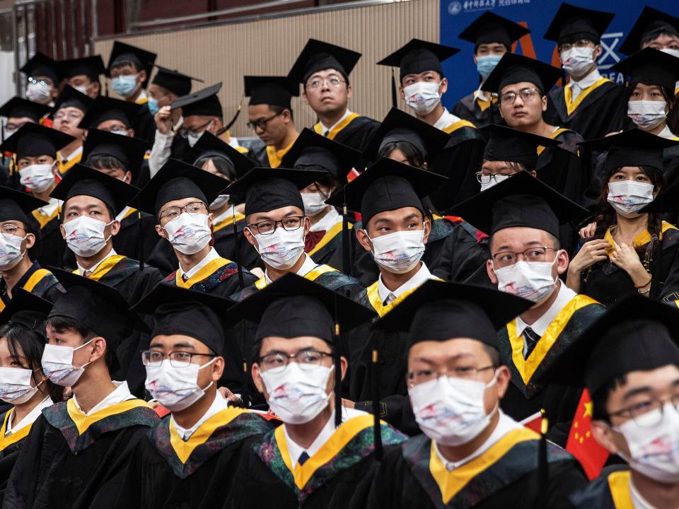 Graduates attend their ceremony at Huazhong University of Science and Technology on June 22, 2022 in Wuhan, Hubei, Chin