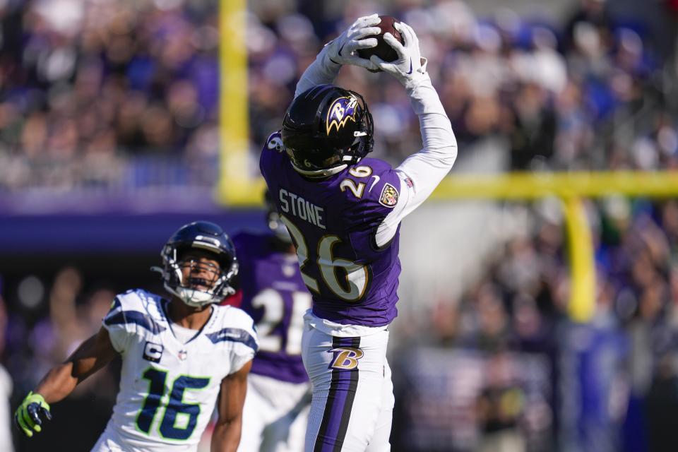 Nov 5, 2023; Baltimore, Maryland, USA; Baltimore Ravens safety Geno Stone (26) catches an interception against the Seattle Seahawks during the first half at M&T Bank Stadium. Mandatory Credit: Jessica Rapfogel-USA TODAY Sports