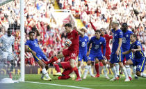 Chelsea's Reece James, second left, handballs on the goal line which results in a red card and a penalty given to Liverpool during the English Premier League soccer match between Liverpool and Chelsea at Anfield, Liverpool, England, Saturday, Aug. 28, 2021. (Mike Egerton/PA via AP)