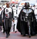 <p>Snoop is the only guy in this galaxy cool enough to hold his own alongside Darth Vader. The rapper was by the evil character’s side as they promoted a <em>Star Wars</em> line for Adidas in NYC’s Times Square. (Photo by Joe Kohen/WireImage) </p>