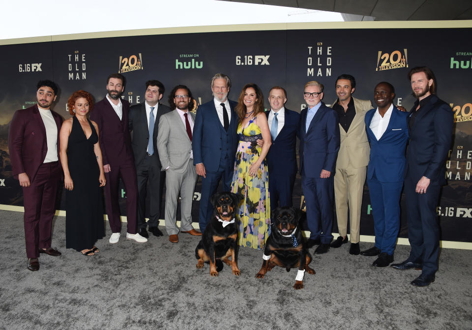 E.J. Bonilla, Alia Shawkat, Jon Watts, Dan Shotz, Robert Levine, Jeff Bridges, Jonathan E. Steinberg, Warren Littlefield, Pej Vahdat, Gbenga Akinnagbe and Bill Heck, with dogs Freya and Cain at The Old Man Season 1 premiere held at Academy Museum of Motion Pictures on June 8, 2022 in Los Angeles, California.