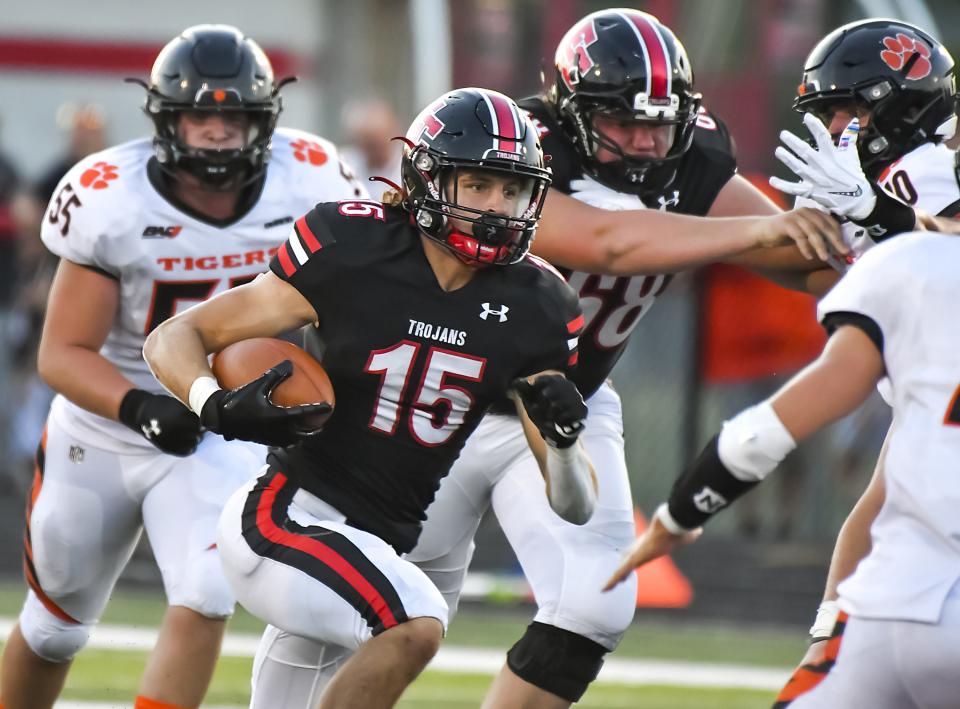 Josh Ringer of East Central runs the ball during the Skyline Chili Crosstown Showdown against Lawrenceburg at East Central High School on Friday, Aug. 19, 2022.