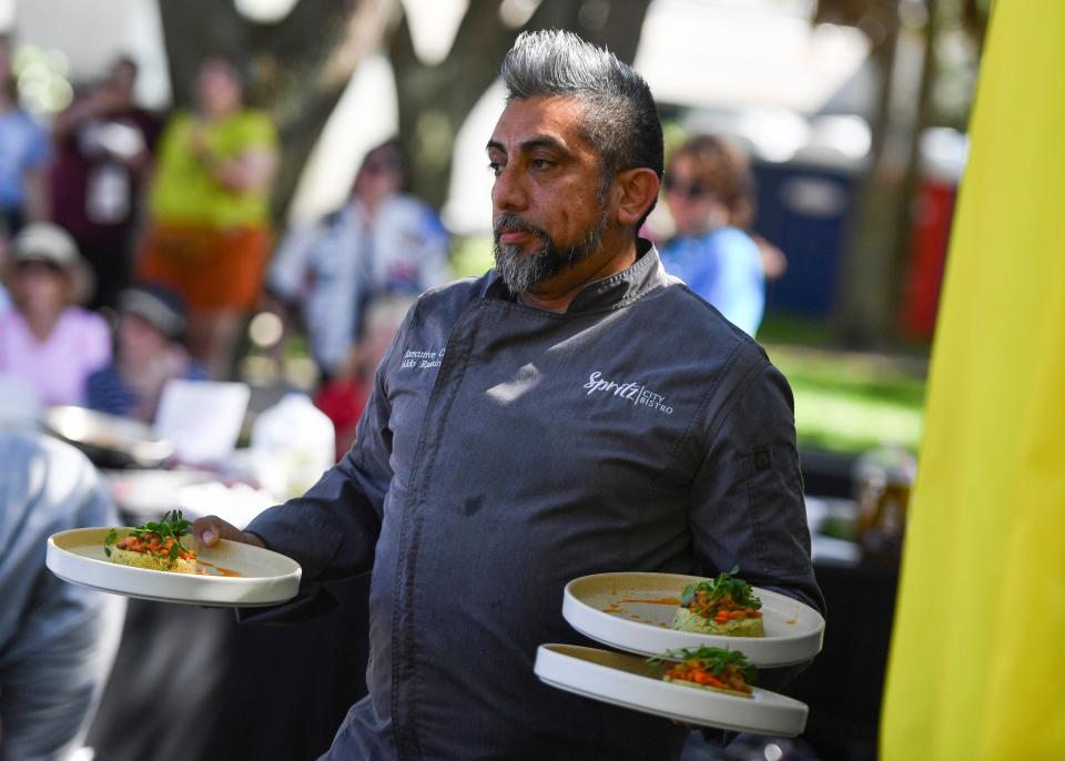 Chef Aldo Ramirez, of Spritz City Bistro, competes in the Stuart Chopped competition during the 35th annual Stuart ArtsFest on Saturday, Feb. 12, 2022, at Gazebo Park in Stuart. The festival featured fine art and craft exhibitors, culinary arts, hands-on activities, live music and theatrical performances. The show continues 10 a.m. to 5 p.m. Sunday. 