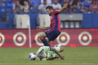 Austin FC midfielder Daniel Pereira (6) falls to the pitch next to FC Dallas midfielder Facundo Quignon (5) during the first half of an MLS soccer match Saturday, Aug. 26, 2023, in Frisco, Texas. (AP Photo/LM Otero)
