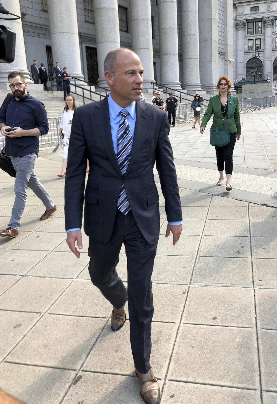 Attorney Michael Avenatti walks past the federal courthouse in New York after making an appearance related to the extortion charges against him, Thursday, Aug. 22, 2019. (AP Photo/Larry Neumeister)
