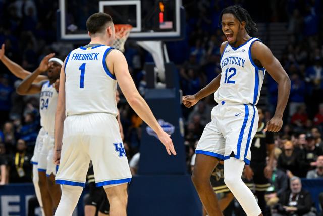 Kentucky guard Antonio Reeves celebrates with CJ Fredrick (1) after making a 3-point basket against Vanderbilt during the first half of an NCAA college basketball game in the quarterfinals of the Southeastern Conference Tournament, Friday, March 10, 2023, in Nashville, Tenn. (AP Photo/John Amis)