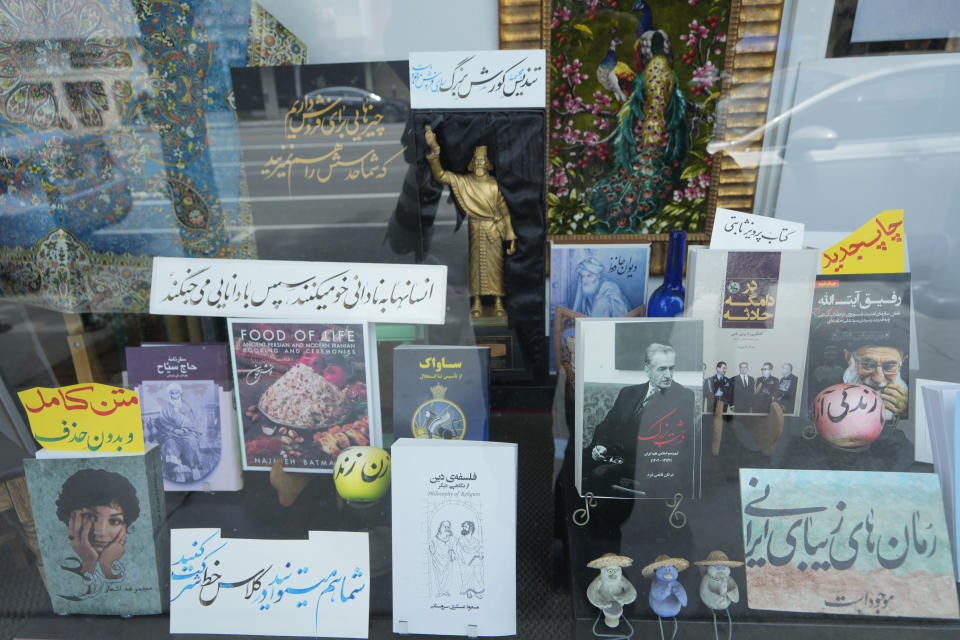Books in Farsi are displayed on the exterior of a bookstore in the so-called "Tehrangeles" neighborhood in the Westwood district of Los Angeles on Monday, May 20, 2024. (AP Photo/Damian Dovarganes)