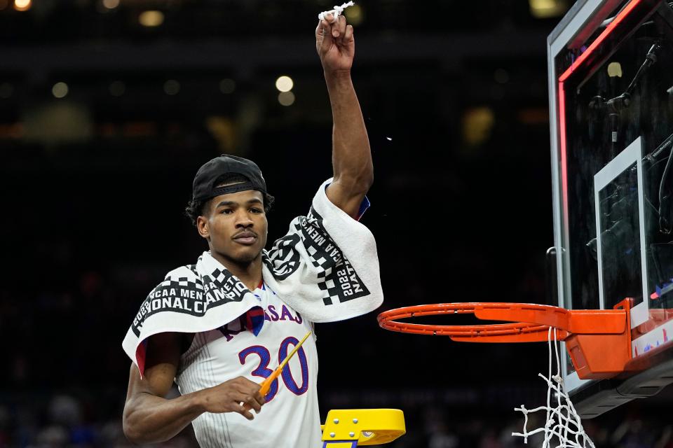 Kansas guard Ochai Agbaji cuts the net after beating North Carolina for the NCAA championship on April 4 in New Orleans.