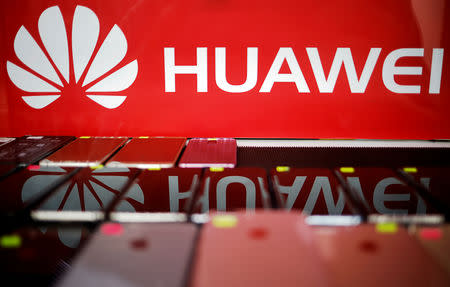 FILE PHOTO: The logo of Huawei is pictured at a mobile phone shop in Singapore, May 21, 2019. REUTERS/Edgar Su/File Photo