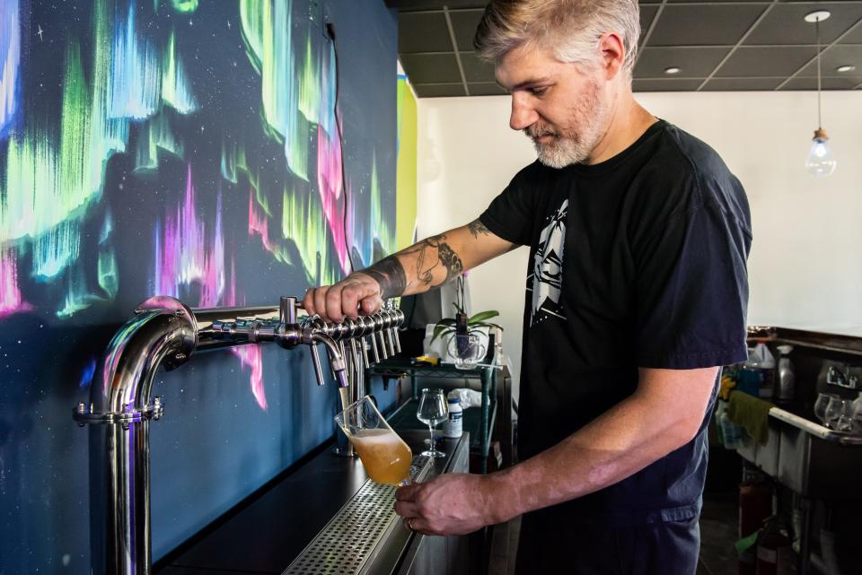 Joe Wisiarski, co-owner and head brewer at Mystic Ways Brewing Co. in Perkasie pours a glass of West Walnut Wallop, a Czech-style pilsner, on Thursday, August 4, 2022.