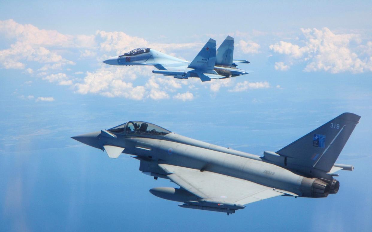 The RAF Typhoon (foreground) was scrambled to intercept the Russian SU-30 Flanker fighter jet in the Estonia/Finland area - REX