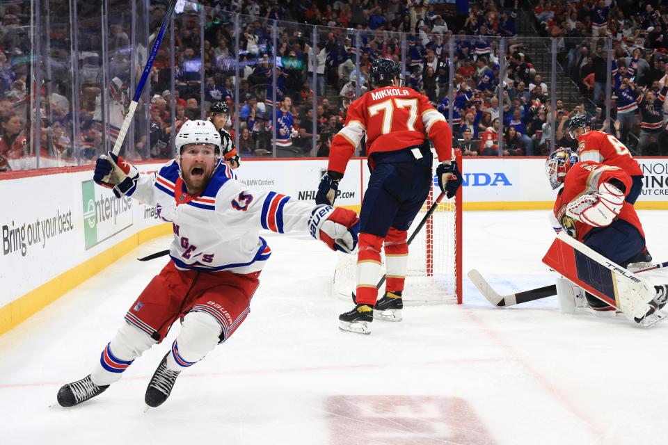 SUNRISE, FLORIDA - MAY 28: Alexis Lafrenière #13 of the New York Rangers celebrates after scoring a goal past Sergei Bobrovsky #72 of the Florida Panthers during the third period in Game Four of the Eastern Conference Final of the 2024 Stanley Cup Playoffs at Amerant Bank Arena on May 28, 2024 in Sunrise, Florida.