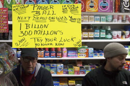 An advertisement for Powerball tickets is displayed in a store in the Brooklyn borough of New York, January 10, 2016. REUTERS/Stephanie Keith