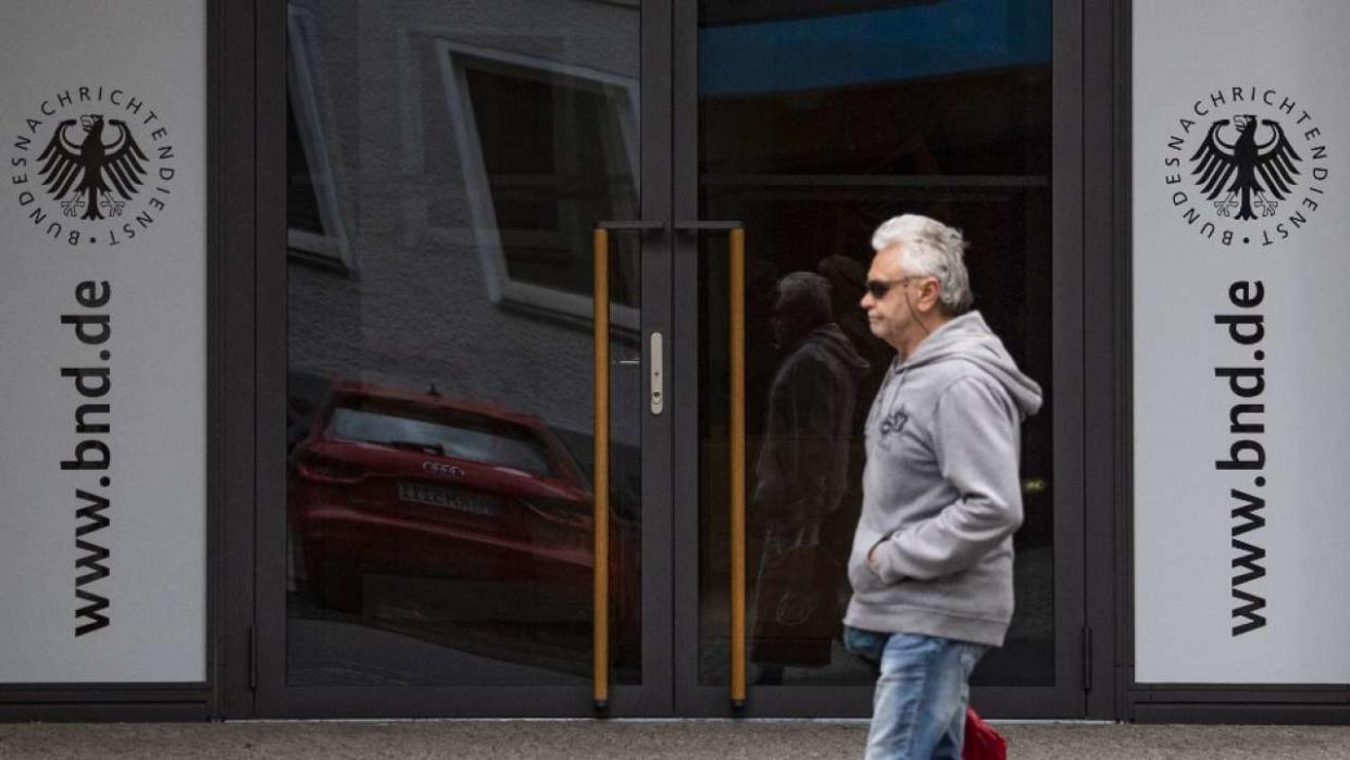 A man walks past the entrance of the visitors' centre at the headquarters of Germany's Federal Intelligence Service (BND) in Berlin on May 19, 2020. - Germany's foreign intelligence service (BND) is not allowed to spy on internet data from foreigners abroad, the country's top court ruled on May 19, 2020 siding with a complaint brought by journalists overseas. (Photo by John MACDOUGALL / AFP)