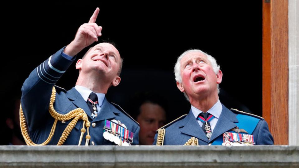 King Charles watching a flypast in awe