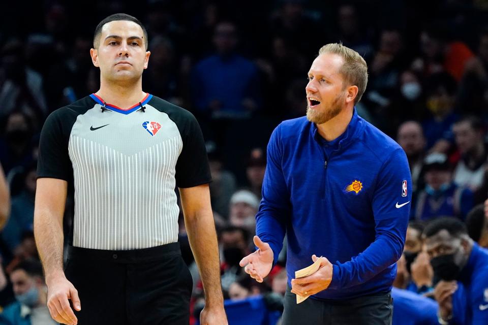 Phoenix Suns coach Kevin Young, right, argues with referee Mousa Dagher, left, after a foul was called against the Suns during the second half of an NBA basketball game against the Oklahoma City Thunder Wednesday, Dec. 29, 2021, in Phoenix. The Suns won 115-97. (AP Photo/Ross D. Franklin)