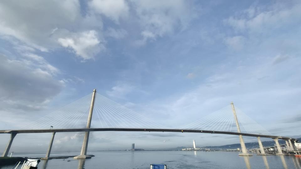 A bridge over water under a clear blue sky