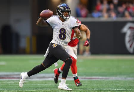 Dec 2, 2018; Atlanta, GA, USA; Baltimore Ravens quarterback Lamar Jackson (8) throws on the run against the Atlanta Falcons during the second half at Mercedes-Benz Stadium. Mandatory Credit: Dale Zanine-USA TODAY Sports