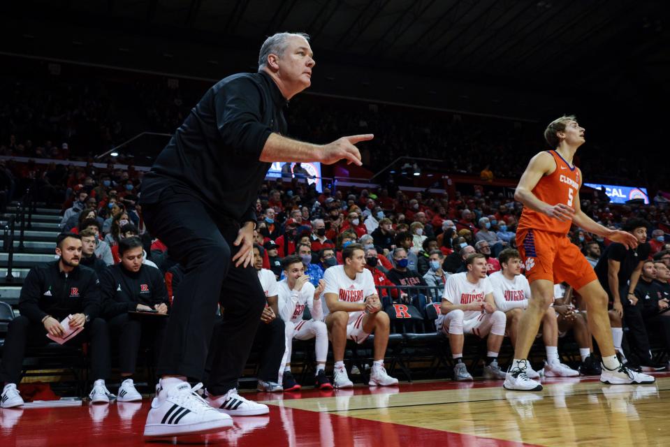 Rutgers Scarlet Knights head coach Steve Pikiell coaches as Clemson Tigers forward Hunter Tyson (5) follows the ball