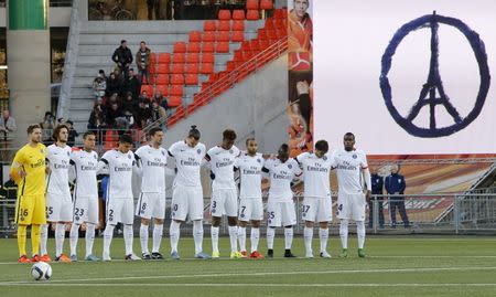Football Soccer - Lorient v Paris St Germain - French Ligue 1 - Moustoir stadium, Lorient, France - 21/11/2015Soccer players of Paris St Germain observe a minute of silence to pay tribute to victims of Paris attacks, before their French Ligue 1 soccer match against LorientREUTERS/Stephane Mahe