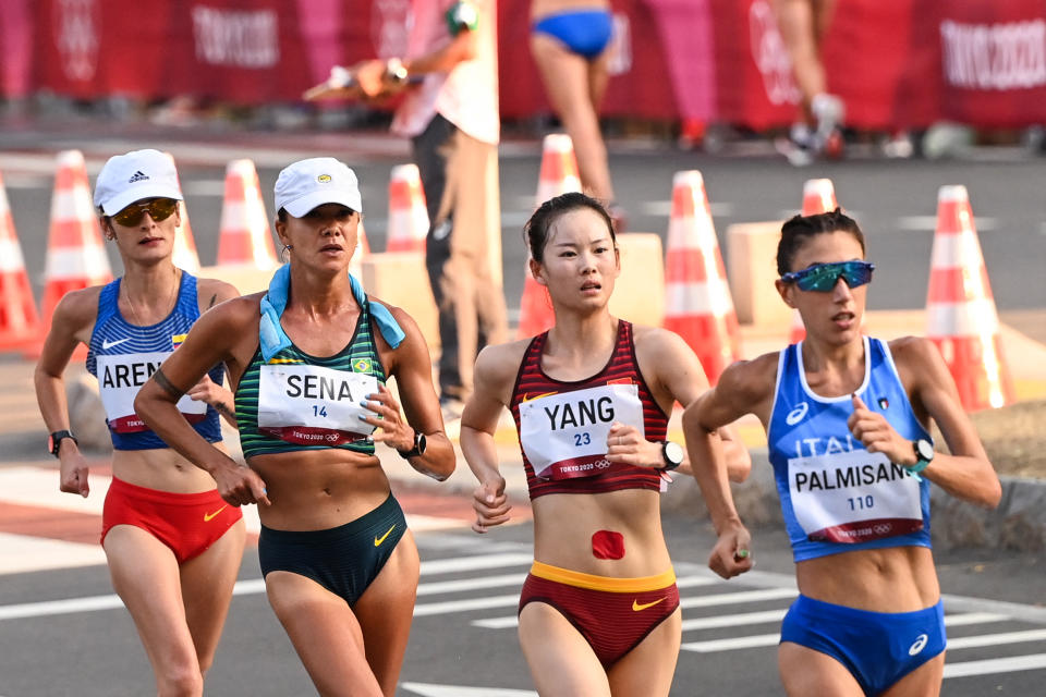 (From front to back) Italy's Antonella Palmisano, China's Yang Jiayu, Brazil's Erica Rocha De Sena and Colombia's Sandra Lorena Arenas compete in the women's 20km race walk final during the Tokyo 2020 Olympic Games at the Sapporo Odori Park in Sapporo on August 6, 2021. / AFP / Charly TRIBALLEAU