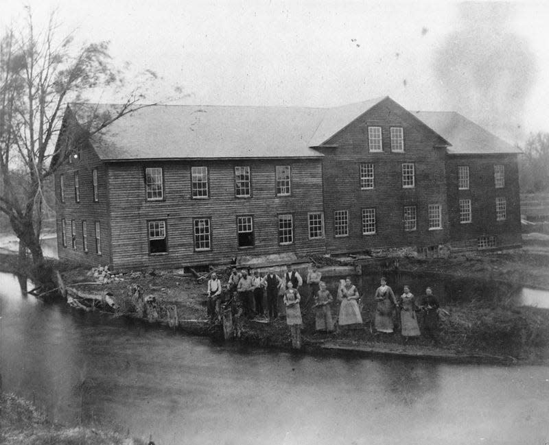 The Woolen Mill and an unknown group of people are seen in Baintertown in old photo. A history of this site in New Paris, now Baintertown Park, will be explored in guided hikes.