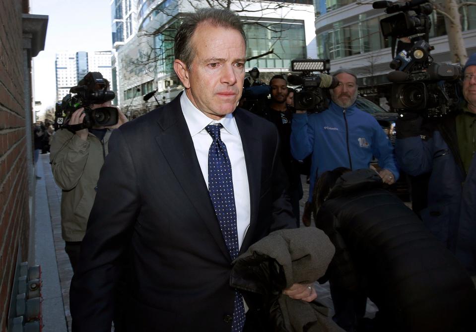 Gordon Ernst, former Georgetown tennis coach, departs federal court in Boston after facing charges in a nationwide college admissions bribery scandal on March 25.