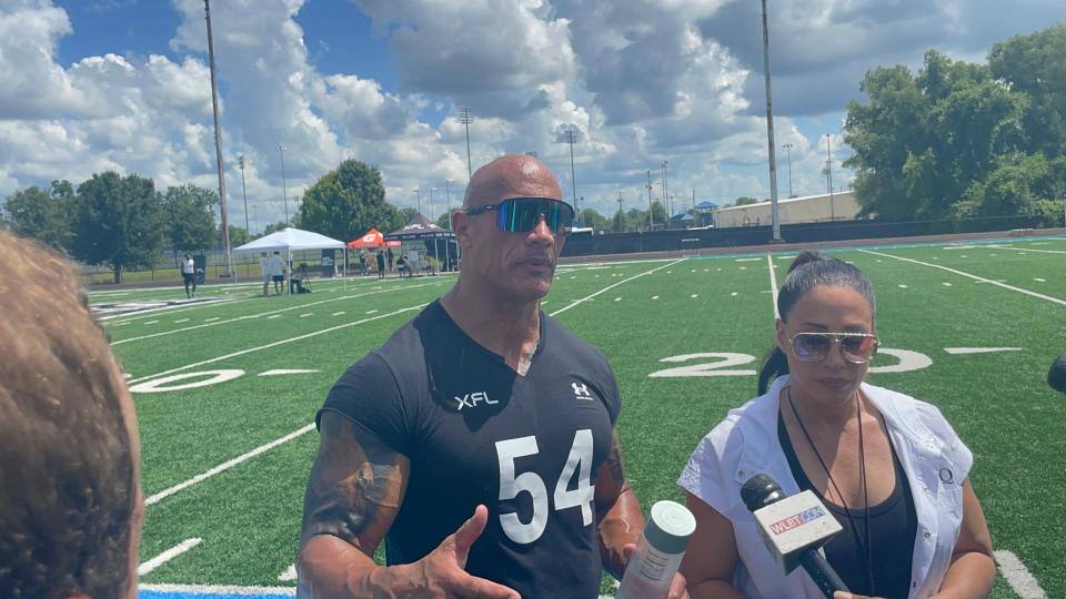 XFL owners Dwayne "The Rock' Johnson and Dany Garcia address reporters at the XFL's HBCU showcase
