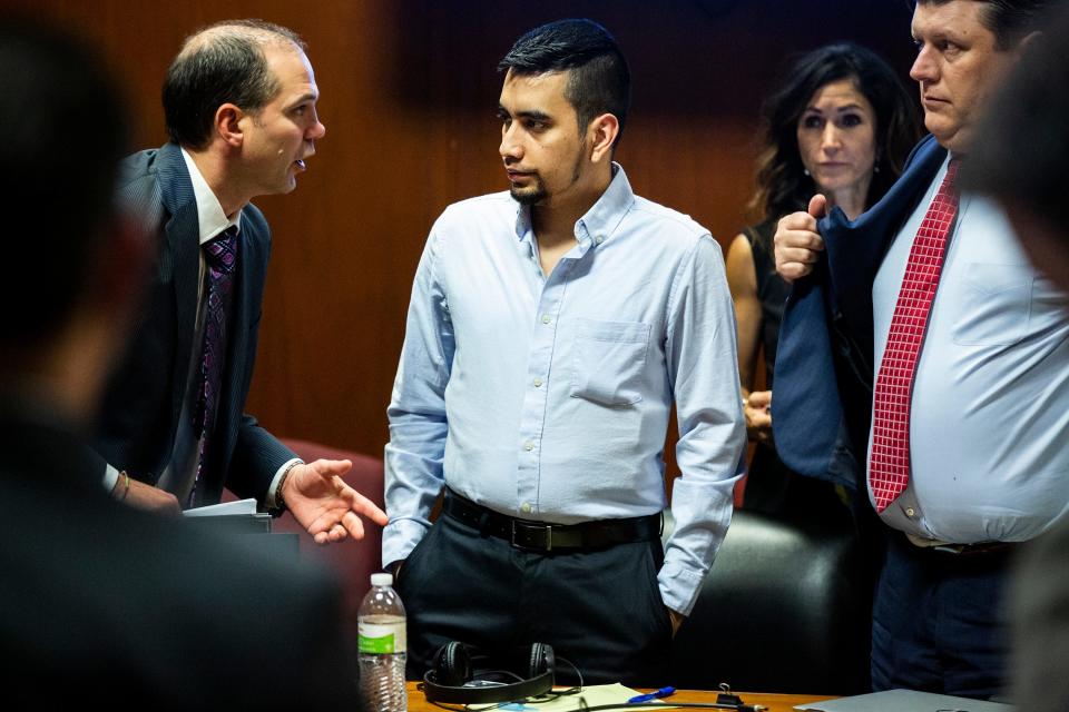 Cristhian Bahena Rivera speaks to court interpreter Steven Rhodes during Bahena Rivera's trail, on Wednesday, May 26, 2021, in the Scott County Courthouse, in Davenport, Iowa.