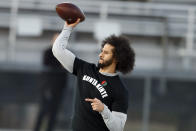 FILE - In this Nov. 16, 2019, file photo, free agent quarterback Colin Kaepernick participates in a workout for NFL football scouts and media in Riverdale, Ga. Kaepernick was a second-round draft pick in 2011 who the next year led the San Francisco 49ers to the Super Bowl. By 2016, he had begun kneeling on the sideline at games during the national anthem to protest social injustice and police brutality. Soon after, he was gone from the NFL, and he has not played since. (AP Photo/Todd Kirkland, File)