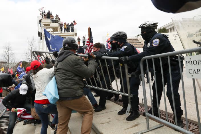 Supporters of U.S. President Donald Trump clash with police officers outside of the U.S. Capitol Building in Washington, U.S., January 6, 2021. REUTERS/Leah Millis