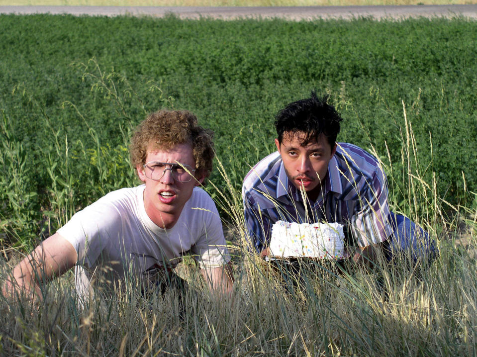 Jon Heder and Efren Ramirez hiding behind some weeds.