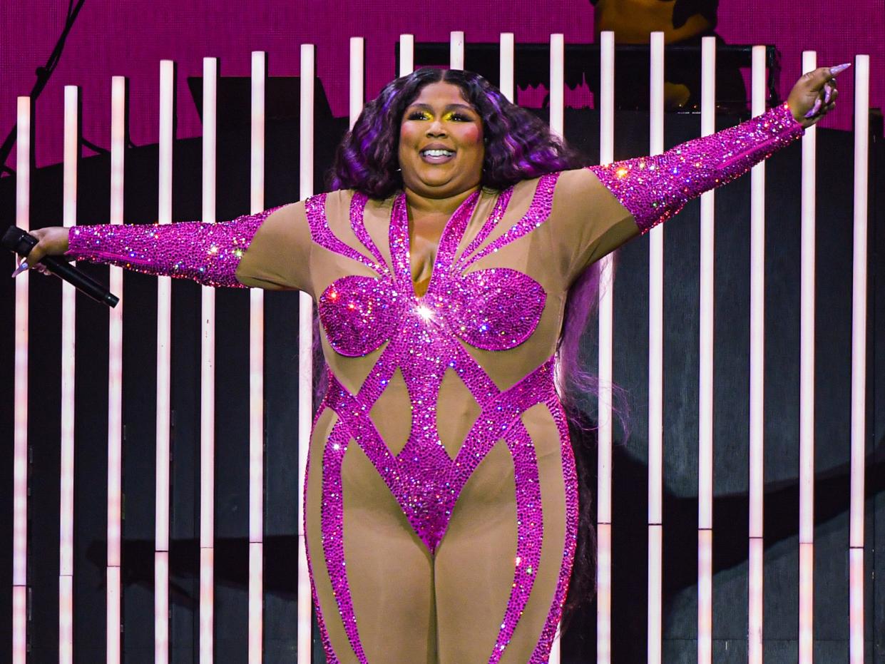 Lizzo wearing hot pink leotard at Toronto concert