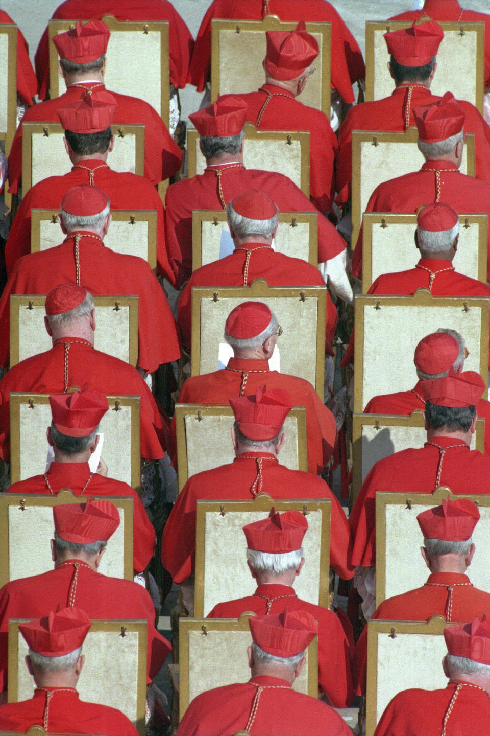 FILE - In this Feb. 21, 1998 file photo, old Cardinals are seen during the Concistory in which the Pope summoned 22 new Princes of the Church, as cardinals are also called, to help him lead the Roman Catholic church, at the Vatican. Pope Francis has chosen men he admires, resembles and wants to honor as the 13 newest cardinals who will be elevated at a formal ceremony Saturday, Oct. 5, 2019. (AP Photo/Andrew Medichini, file)