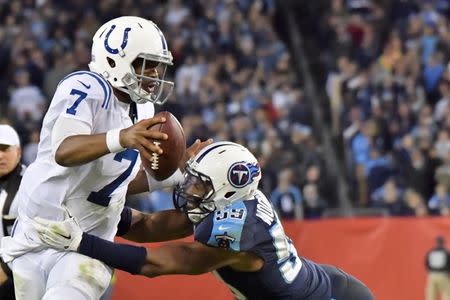 Oct 16, 2017; Nashville, TN, USA; Indianapolis Colts quarterback Jacoby Brissett (7) is tackled by Tennessee Titans linebacker Wesley Woodyard (59) during the second half at Nissan Stadium. Mandatory Credit: Jim Brown-USA TODAY Sports