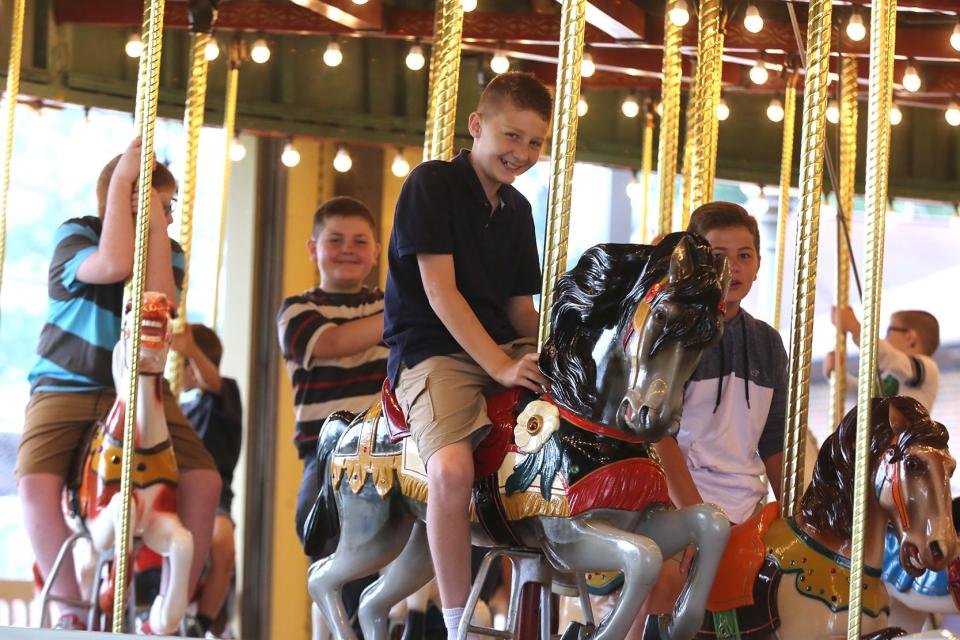 Writer and director Eric Swinderman, right, works on a scene in June 2018 at the Tuscora Park carousel. The scene was shot for Swinderman's movie, "The Enormity of Life," which carried the title "Anhedonia" during production.